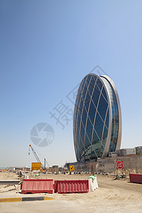 正在建设中的碟形建筑 阿联酋阿布扎比景观城市建筑学建设者飞碟多层机械摩天大楼工作商业图片