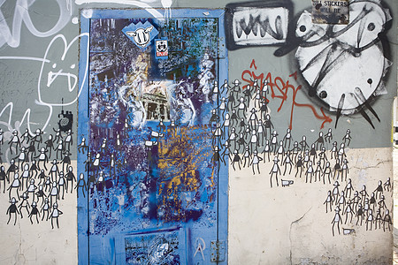涂鸦人民和蓝门破坏者青少年女孩青年文化艺术城市眼睛黄色街道图片