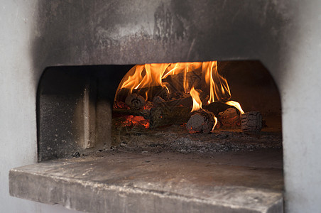 意大利传统比萨饼木烤炉火焰用餐柴火面包火炉食物餐厅烤箱壁炉午餐图片