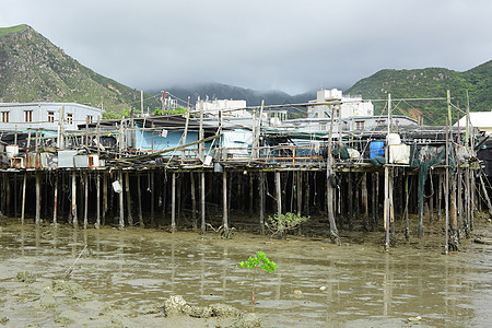 Taa O渔村场景天空旅行村庄住宅窝棚木头棚户区钓鱼风化图片