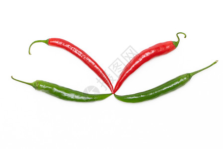 红辣椒和绿辣椒曲线胡椒生产美食绿色异国食物蔬菜白色情调图片