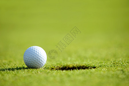 近洞附近的高尔夫球休闲绿色运动对象摄影活动水平图片