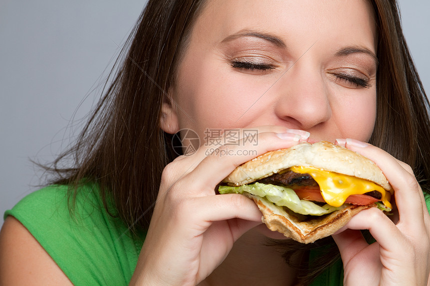 食食食物的女童灰色青少年饮食背景青年午餐黑发快乐女孩包子图片