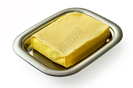 银黄油盘上的黄油分离产品白色盘子黄色餐具服务金属背景图片