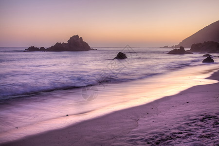 菲佛海滩海滩冲浪海洋日落海浪支撑风景戏剧性海岸线公园图片