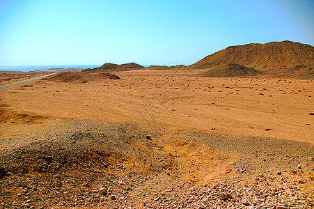埃及沙漠蓝色爬坡旅游晴天戈壁阳光橙子地平线小丘太阳背景图片