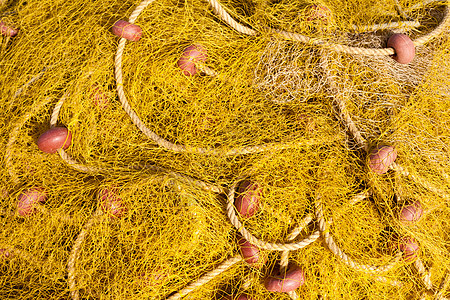 黄色渔网堆纠纷海洋港口网格漂浮物尼龙软木绳索渔业海鲜图片