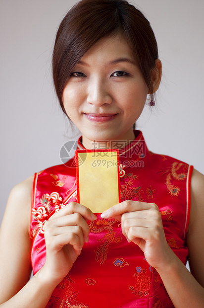 中国新年快乐旗袍衣服快乐女性女孩女士喜悦手势问候语传统图片