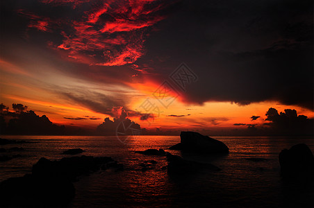 太阳升起海滩日落天际海洋气候云景天气海岸反射天空图片