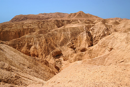 死海附近的橙色沙漠峡谷侵蚀干旱风景砂岩红色橙子山沟石头洞穴风化图片
