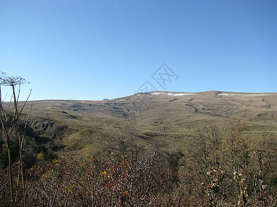 腊果纳基高原高山一条路线斜坡风景剪影山丘背景山脉全景天空图片