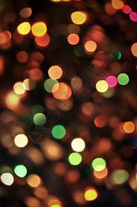 圣诞灯红色背景新年火花辉光黄色乐趣圆形情绪魔法图片