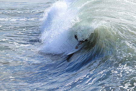 冲浪运动员粉饰蓝色海浪管子碰撞竞技运动娱乐冲浪者图片