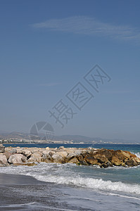 巴努斯港海滩和石码头海岸线旅游支撑海岸海浪海景码头天空岩石假期图片