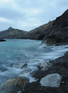 夜间的海海滩天空液体岩石薄雾阳光海岸线海景边缘石头图片