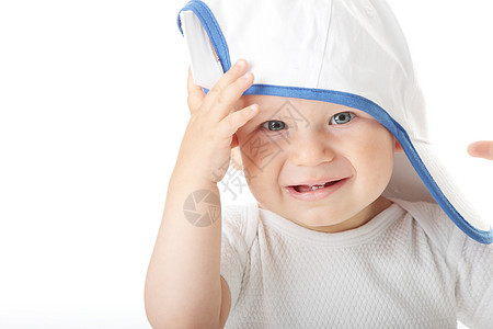 婴儿在碱盘顶上尝试男生眼睛运动男性情感新生孩子乐趣喜悦帽子图片