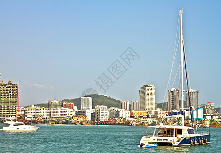 中国三亚凤凰岛港壁垒风景地标蓝色场景渡船运输港口绿色城市图片