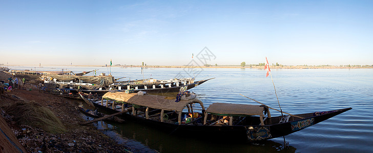 尼日尔港口的船舶插图冒险运输木头原住民市场乘客加载船运行李图片