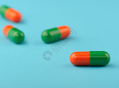蓝色背景上设置胶囊白色科学药片红色药店化学剂量团体工作室疾病图片