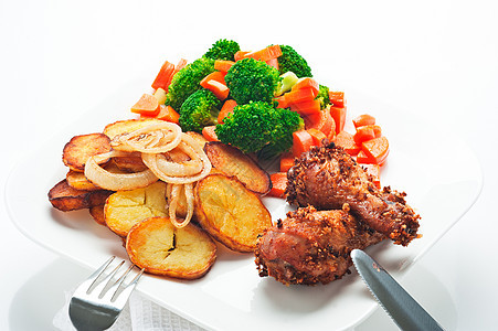 炒土豆花椰菜胡萝卜和烤鸡烹饪美食家禽橙子桌子油炸食物饮食菜单餐厅图片