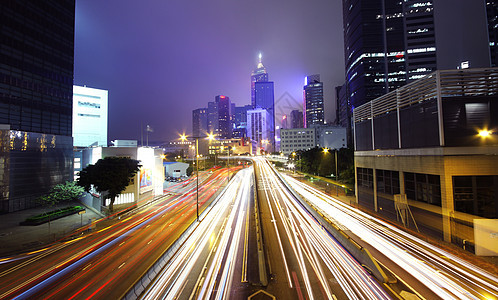 香港忙碌的夜间交通戏剧性建筑学市中心建筑大街汽车地标辉光运动车辆图片