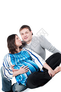 美丽的一对夫妇孕妇微笑喜悦情感父亲男性女士女孩父母男人母亲图片