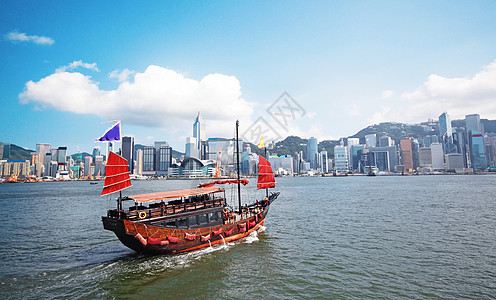 与游客在香港维多利亚港搭乘的垃圾船旅行渡船血管酒店建筑城市办公室巡航领土邮轮图片