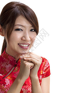 中国新年快乐女孩快乐祝福扣子戏服手势节日女性微笑文化图片