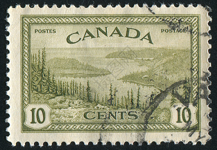 加拿大大熊湖集邮邮资支撑古董海豹邮票邮件建筑反射枞树背景