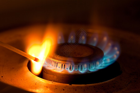 由丙烷燃烧器点燃的火柴烧伤宏观蓝色辉光炉灶橙子火炉丁烷烹饪化石图片