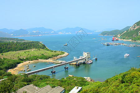 日间与香港山脊接壤的海岸线城市支撑村庄反射港口假期海滩蓝色爬坡海岸图片