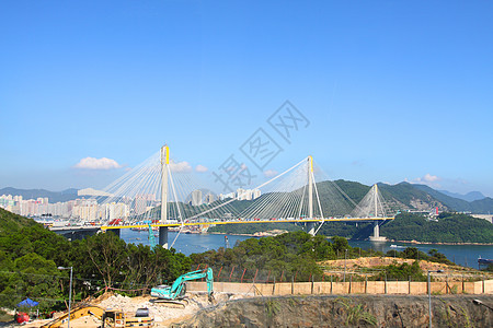 白天在香港的廷九桥旅行游客天际连接器金属运输电缆海岸反射城市图片