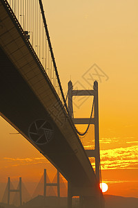 日落时清马桥连接器业务电缆反射海岸建筑天空运输旅行游客图片