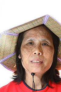 一个戴帽子的50个亚洲女人眼睛皱纹老年幸福奶奶老化退休女士公民商业图片