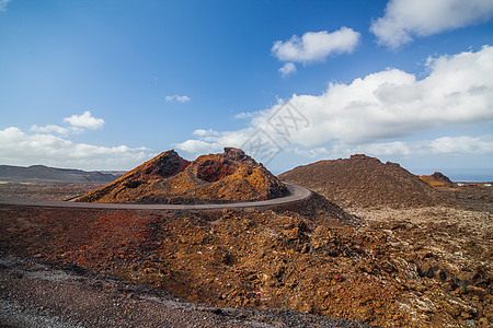 Timanfaya山脉火灾火山洞穴土地冲浪花园蓝色国家旅行天空棕榈图片