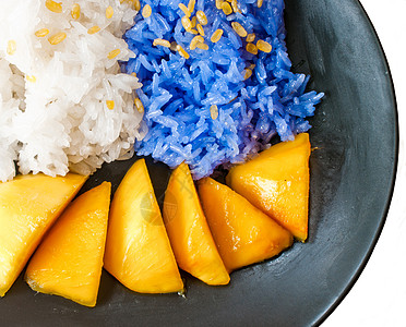 粘硬的米饭芒果泰国甜点牙齿食物椰子美食热带早餐竹子食品紫色牛奶图片