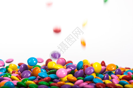 巧克力按钮黄色紫色粉色绿色糖果食物红色蓝色白色橙子背景图片