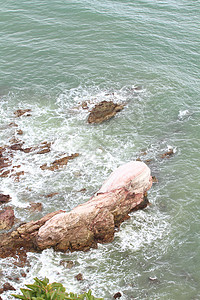热带海滩上的石头情调碎石海景海岸阳光太阳边缘海岸线岩石支撑图片