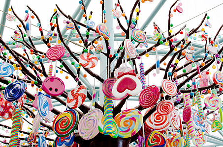 糖果树阳光街道漩涡童年笨蛋甜点乐趣营养味道市场背景图片