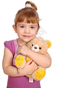 带泰迪熊玩具的漂亮女孩图片