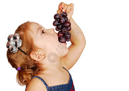 小女孩吃葡萄工作室拍摄图片