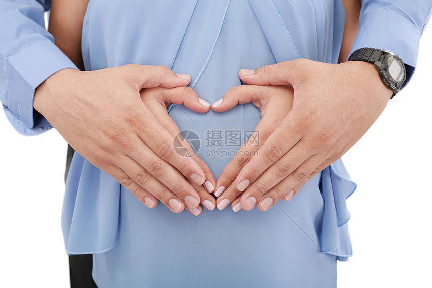 孕妇的手和丈夫的心胸形状夫妻婚姻母亲保健妻子怀孕身体家庭女士父亲图片