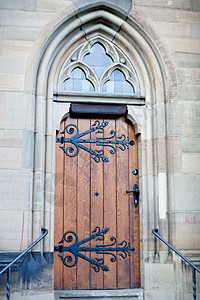 哥特教堂门入口窗户石头金属棕色玻璃建筑建筑学灰色木头图片