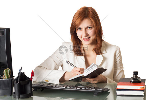 妇女写在一张笔记本上图片
