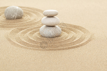 沙中平衡的石块专注岩石场景石头灵魂精神艺术卵石海滩圆形图片