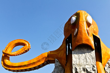 橙章鱼骑马童年吸引力胜利游乐场蓝色车轮快感手臂假期天空图片