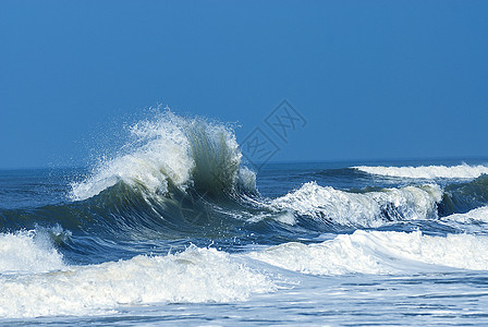 美丽的蓝海浪潮乐趣力量海滩破岸液体冒险天气蓝色冲浪者海洋图片