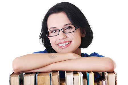 带着书籍微笑的年轻女学生快乐知识书店教育女学生历史阅读大学科学字典智慧图片
