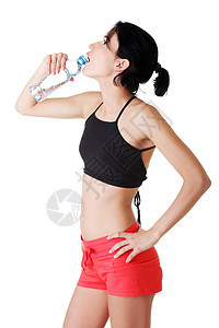 年轻健康妇女饮用矿泉水口渴瓶子液体塑料女性女孩矿物运动员微笑蓝色图片