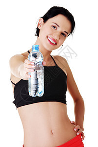 拥有一瓶水的水的年轻 体贴身体的妇女图片